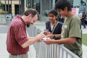 Kitchener, Ont. native Dawud Wharnsby, a Canadian singer/songwriter/poet best known for his work in musical poetic genre interacts with his young fans at the MuslimFest. Photo courtesy, MuslimFest.