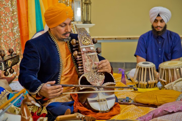 Prof. Surinder Singh seen here playing the saranda. The ancient musical instrument which had faded into obscurity has been revived by Surinder Singh. Photo courtesy, Harbirz Inc.