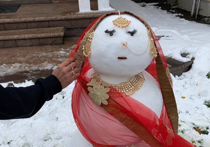 A snow-woman created to look like a South-Asian bride