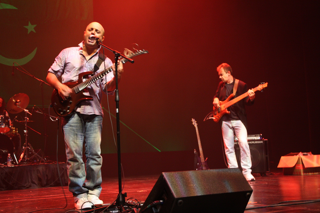 Image shows an artist with guitar singing. The singer is a member of Junoon, a sufi-rock band.